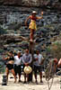 Lora balances above Kathy, Bob, Thomas Patrick, and Mike