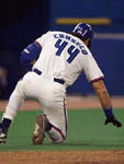  Canseco falls to the ground after fouling a ball off his knee on 4/30/98 (Toronto Sun)