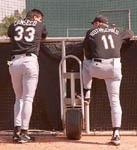 Jose and manager Larry Rothschild having a chat on 2/25/99 (SP Times) 