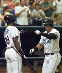 A high-five from Fred McGriff after homer #10 on 4/25/99 (AP)