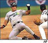 Jose getting tagged out at third base on 7/9/99 - his last game before having back surgery (SP Times)